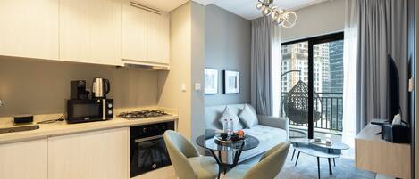 Deluxe Apartment, 1 Bedroom, Lake View | Living area | 50-inch Smart TV with digital channels