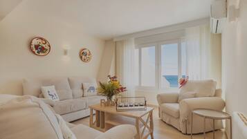 Family Villa, Multiple Bedrooms, Sea Facing (Bahia Dorada Complete Villa) | Living area | 21-inch TV with cable channels, fireplace