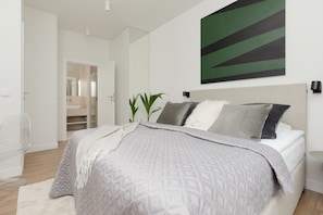 Desk, laptop workspace, bed sheets