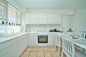 Fridge, oven, coffee/tea maker, cookware/dishes/utensils