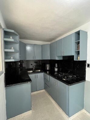 Private kitchen - Charming 3-bedroom house in beautiful Santo Domingo Este with WiFi, AC (Santo Domingo Este)