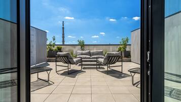 Deluxe-huoneisto, terassi | Terassi/patio