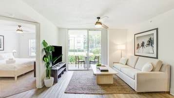 Deluxe Apartment, 3 Bedrooms (Self Check-in with Virtual Front Desk) | Living area | Flat-screen TV