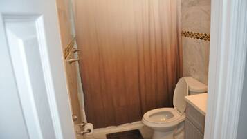 Shower, towels, soap, toilet paper
