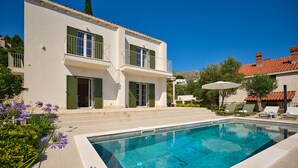A two-story house with a swimming pool, green shutters, and outdoor seating. - Hedera Estate, Villa Hedera Xviii (Zupa dubrovacka)