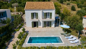 A two-story building with a swimming pool, outdoor seating, and a garden. - Hedera Estate, Villa Hedera Xviii (Zupa dubrovacka)