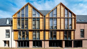 A modern two-story building with large windows and a brick facade. - Micklegate by Supercity Aparthotels (York)