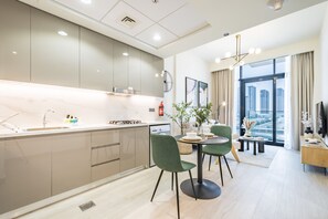 Enjoy a spacious open-plan kitchen with a central island and city views from the large window.