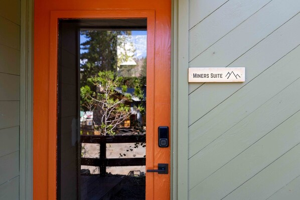 A door with a sign reading "Miners Suite" and a keypad lock. - Miners Suite in Shaver Lake (Shaver Lake)
