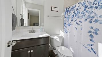 Hair dryer, towels, soap, shampoo