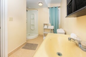 Shower, hair dryer, towels, toilet paper