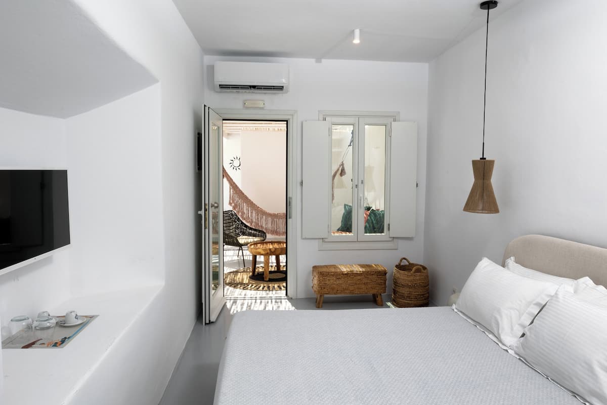 Junior Suite, Pool View | 1 bedroom, in-room safe, iron/ironing board, free WiFi