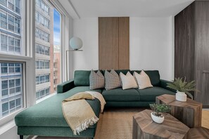 Executive Suite | Living area | 55-inch TV with satellite channels -  The Aurelien Luxe Collection (Toronto)