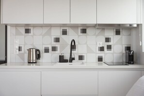 Fridge, microwave, stovetop, coffee/tea maker