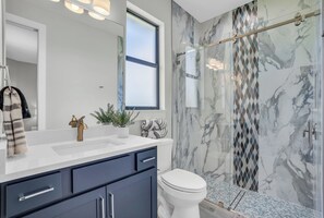 Shower, hair dryer, towels