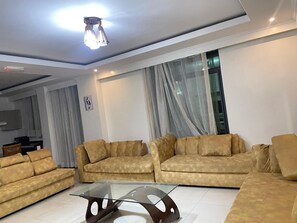 Quarto casal luxo, vista para a cidade | Área de estar