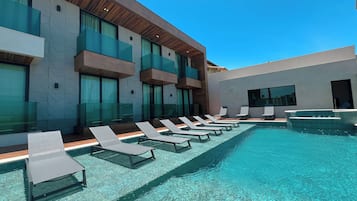 Outdoor pool, open 10:30 AM to 9:00 PM, pool umbrellas, pool loungers