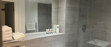 Shower, hair dryer, towels, soap