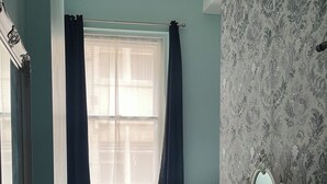 A bedroom with two beds, a dresser, a mirror, and a window with curtains. - Location, Location, city centre apartment, 2 bedrooms, 2 bathrooms (Liverpool)