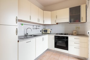 Apartment, Balcony | Private kitchen | Fridge, microwave, stovetop, coffee/tea maker - Casa Berti by Wonderful Italy (Bologna)