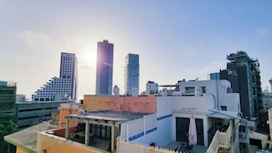 A cityscape with modern high-rise buildings and a clear sky. - Ben Yehouda Obsidian (Tel Aviv)