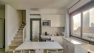Apartment | Living area | 65-inch flat-screen TV with cable channels