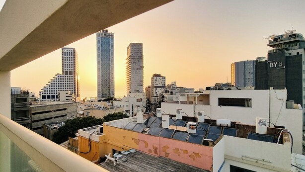 A cityscape with modern high-rise buildings and a clear sky. - Ben Yehouda Obsidian (Tel Aviv)