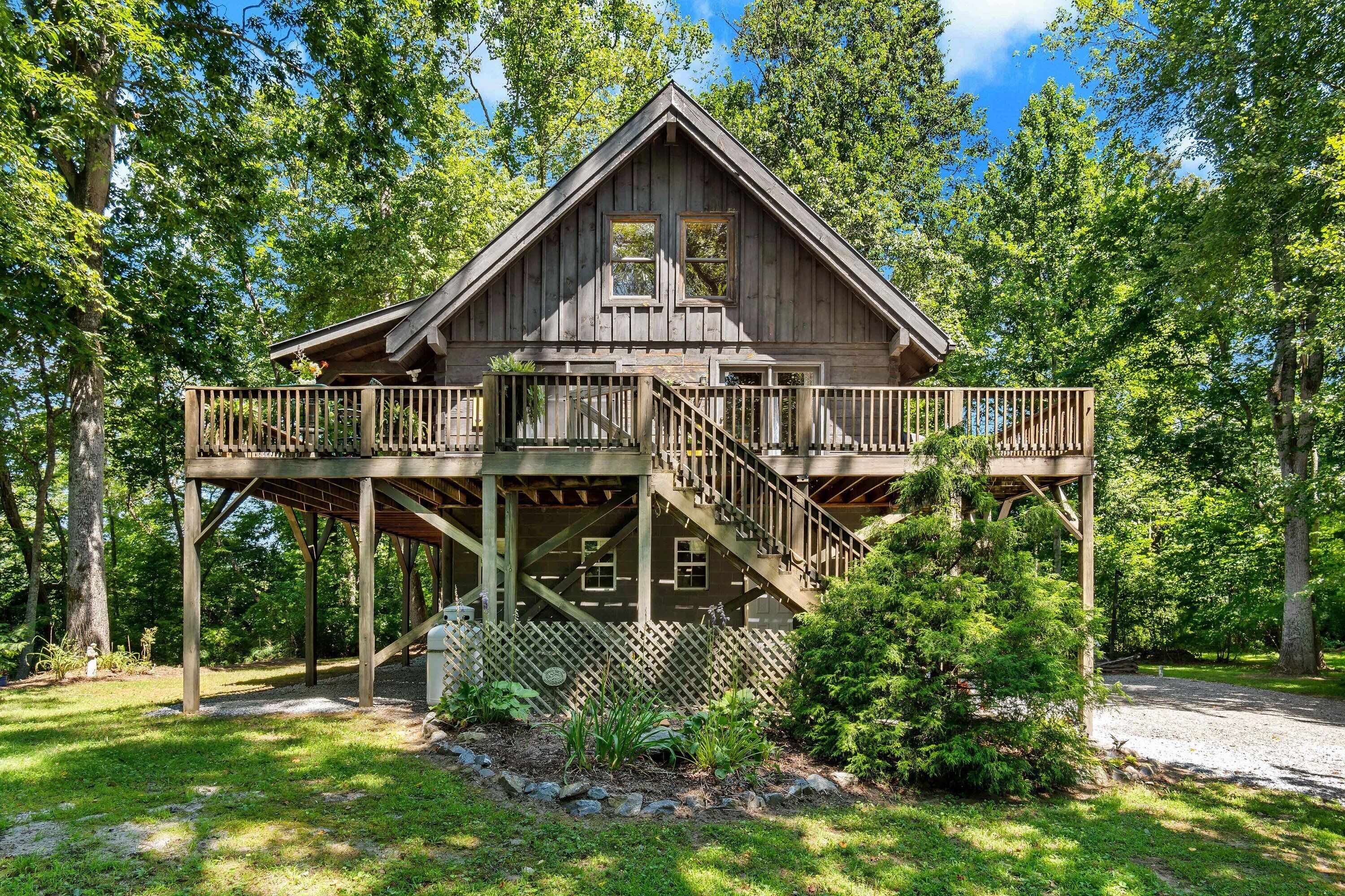 River Retreat Cabin | Pet Friendly, Fire Pit, River View & 10 min. to Tubing!