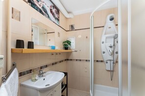 Shower, hair dryer, towels, soap