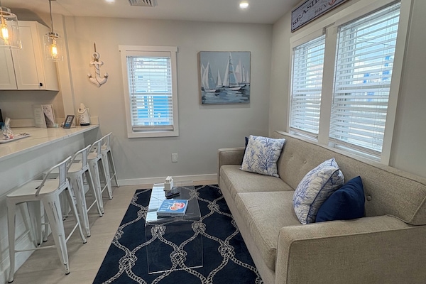Living room and kitchen counter island that seats 4 people
