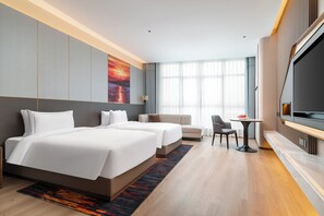 Premium bedding, down duvets, free minibar, laptop workspace