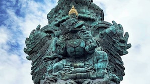 A large, ornate sculpture with wings and a golden crown, set against a partly cloudy sky. - Parigata Resorts Jimbaran (Jimbaran)