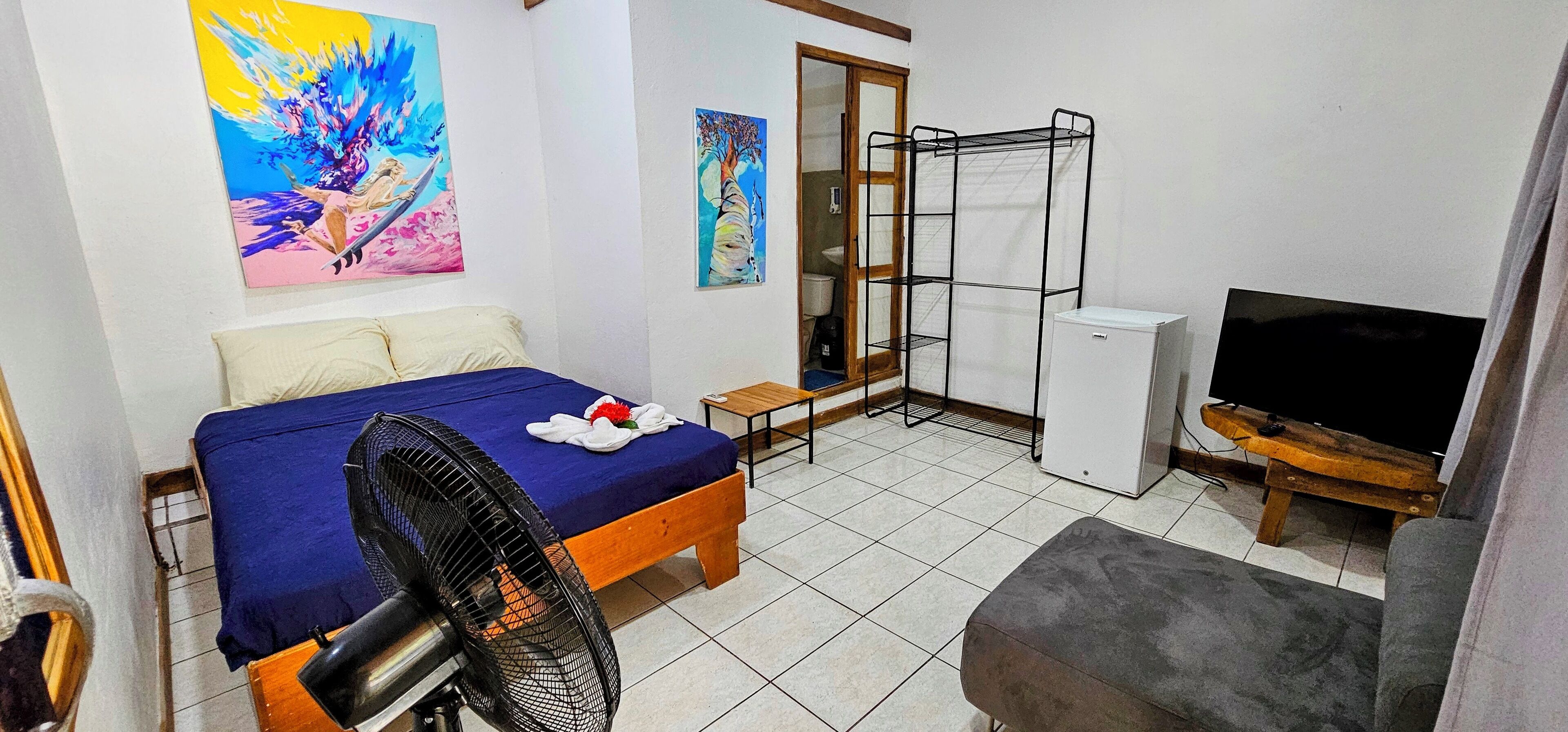 Quarto quádruplo standard, banheiro privativo, vista para o jardim | Wi-Fi de cortesia