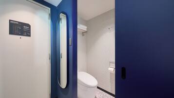 Eco-friendly toiletries, hair dryer, slippers, bidet