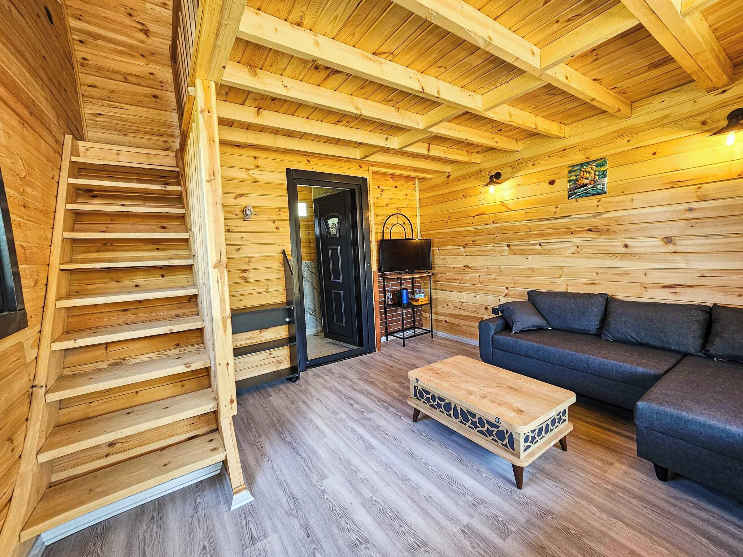 Deluxe Bungalow, Lake View | Living area | 80-cm LED TV with satellite channels