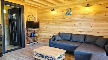 Deluxe Bungalow, Lake View | Living area | 80-cm LED TV with satellite channels