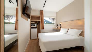 Desk, iron/ironing board, bed sheets