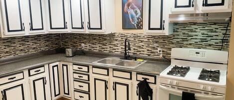 Fridge, microwave, stovetop, coffee/tea maker