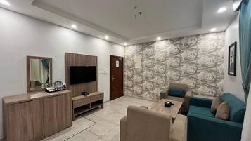 Family Apartment | Living room | 50-inch flat-screen TV with cable channels