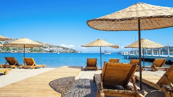 Private beach, free beach cabanas, beach shuttle, sun loungers