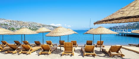 Private beach, free beach cabanas, beach shuttle, sun-loungers