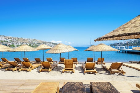 Private beach, free beach cabanas, beach shuttle, sun loungers