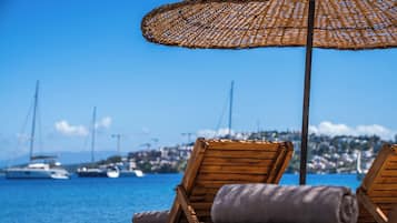 Private beach, free beach cabanas, beach shuttle, sun loungers