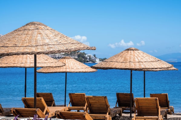 Private beach, free beach cabanas, beach shuttle, sun loungers