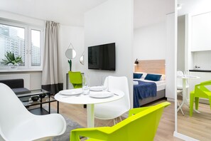 24-inch flat-screen TV with satellite channels - Warsaw Apartment One Bedroom by Renters (Warsaw)