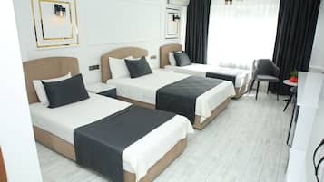 Family Quadruple Room, City View | In-room safe, desk, laptop workspace, soundproofing