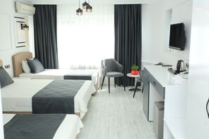 Family Quadruple Room, City View | In-room safe, desk, laptop workspace, soundproofing - HOTEL DEMİRCAN (Istanbul)