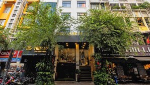 A multi-story building with a restaurant at the ground level. - A25 Premium Hotel - 277 Le Thanh Ton (Ho Chi Minh City)