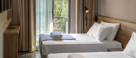 Quarto standard | Roupas de cama premium, frigobar, Wi-Fi de cortesia, roupa de cama