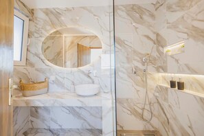 Shower, hair dryer, towels, toilet paper